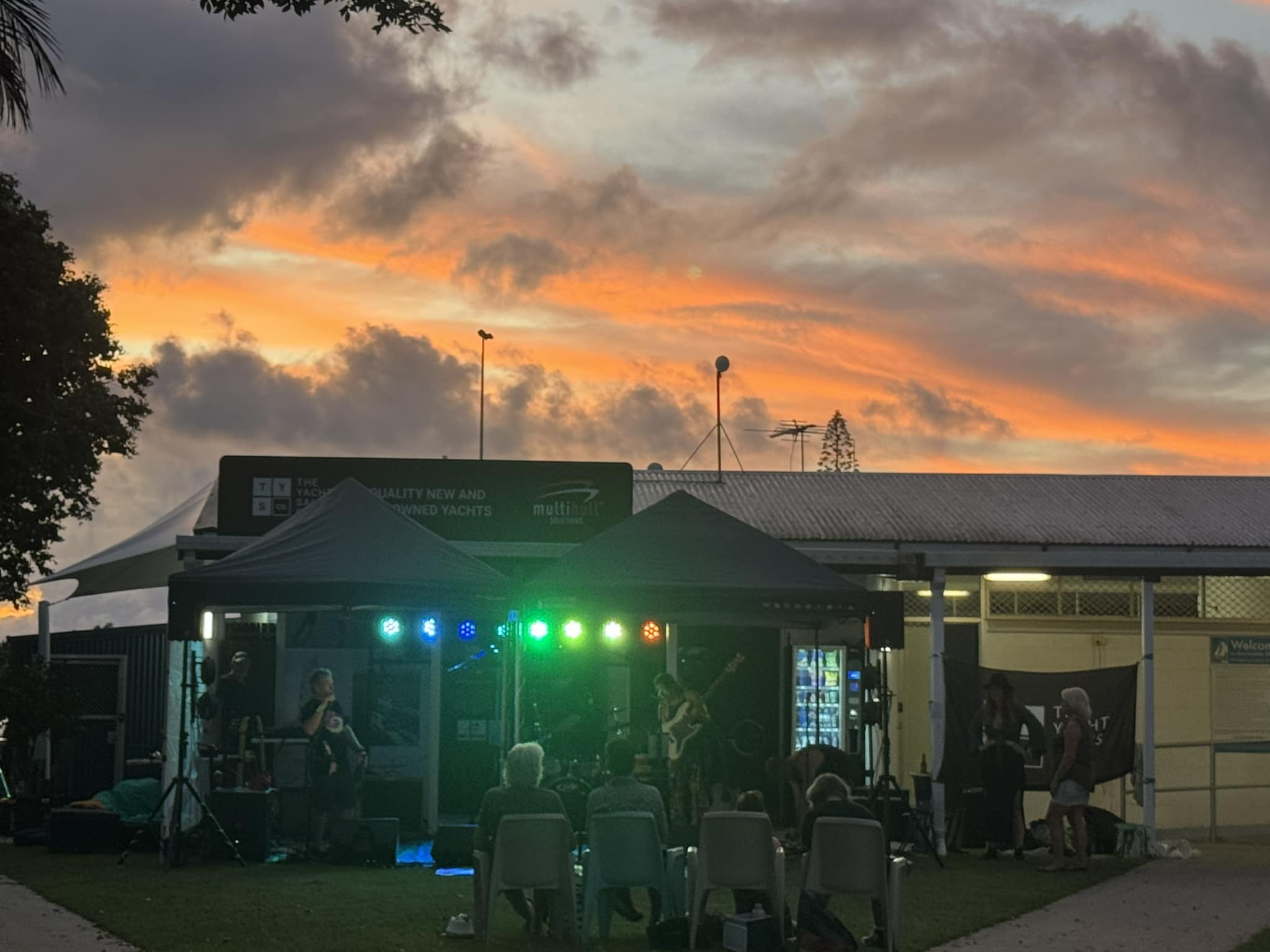 Ackamarackus playing an outdoor gig at sunset